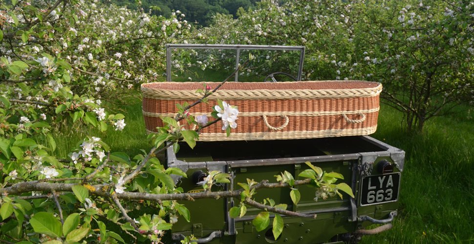 Wicker Coffin on Land Rover in Blossom